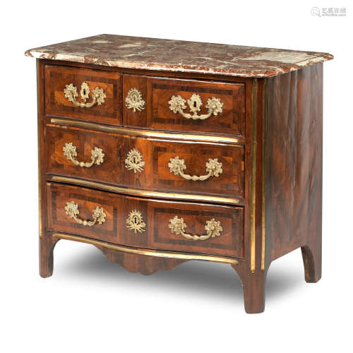 A French Régence walnut, crossbanded and brass mounted commode, early 18th century