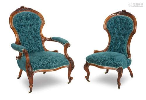 A pair of 19th century walnut ladies and gents chairs
