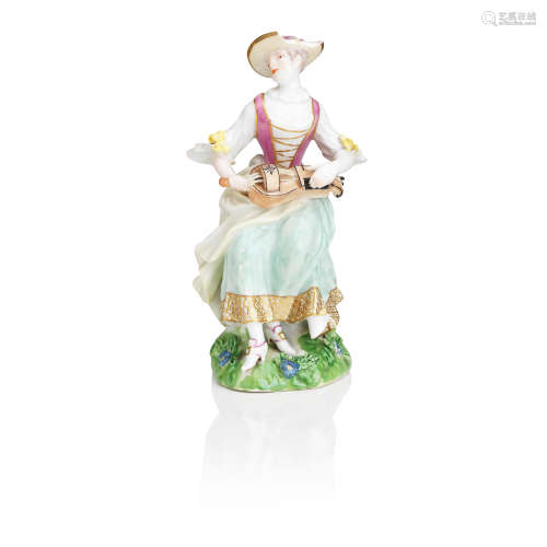 A Meissen figure of a lady playing the hurdy-gurdy 18th century