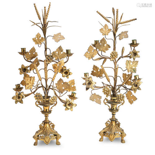 A pair of 19th century brass and gilded metal candelabra