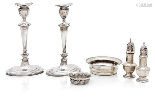 A pair of modern Neo-classical style silver candlesticks by D.J.Silver, London 1967