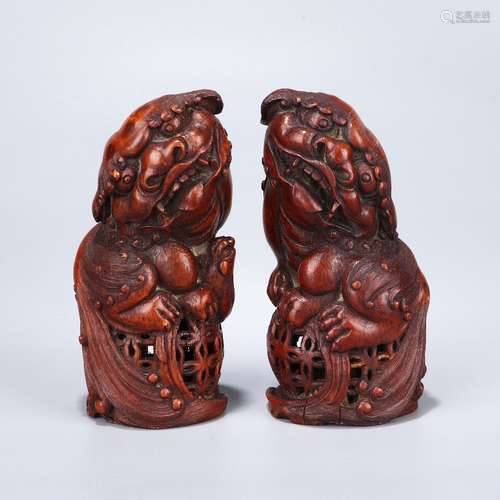 A Pair of Chinese Carved Bamboo Lion Ornaments