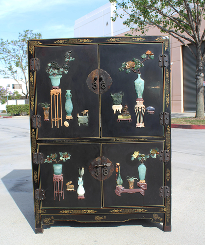 A Lacquer Cabinet with jade, soapstone, an…