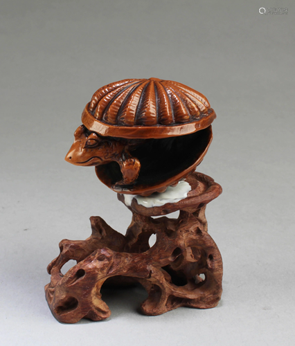 A Carved Wooden Frog Figurine