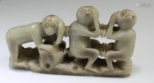 A Carved Stone Three-Monkey Figurine