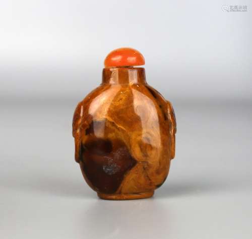 A Chinese Amber Snuff Bottle Carved with Lion Mask