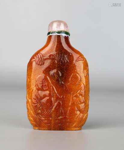 A Chinese Gold Amber Carved with Figures, Qing Dynasty,