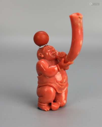 A Chinese Coral Snuff Bottle in the Form of Boy Playing