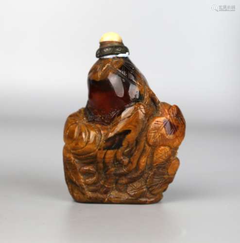 A Chinese Amber Snuff Bottle Carved with Fruits, Qing
