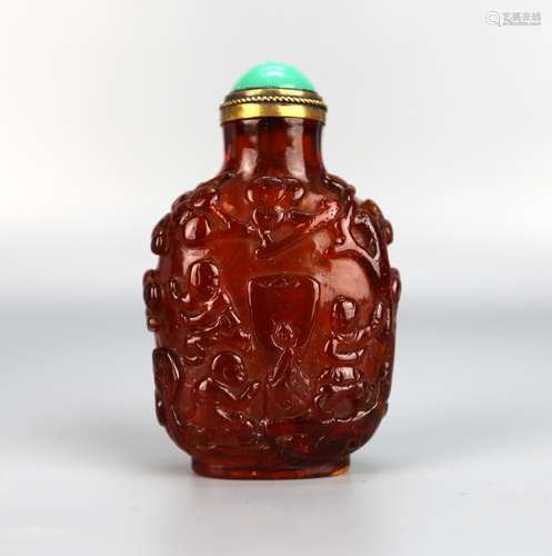 A Chinese Amber Snuff Bottle Carved with Figures,