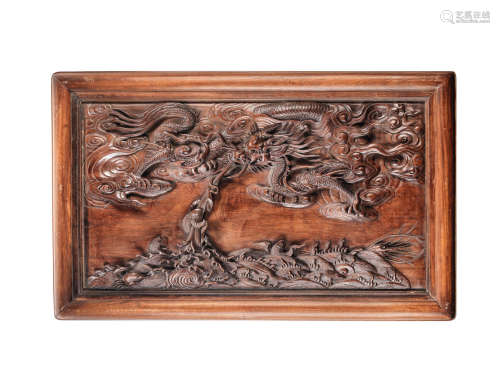 A rosewood 'dragon' panel Late Qing Dynasty