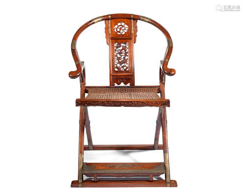 A rosewood horseshoe-back folding chair 19th/20th century