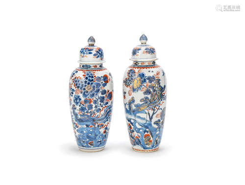 A pair of Chinese Imari slender oviform jars and covers 18th century