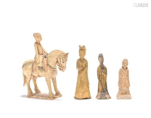 A straw glazed equestrienne and three pottery figures Sui/Tang Dynasty
