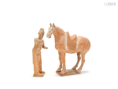 A painted pottery model of a horse and foreign groom Tang Dynasty