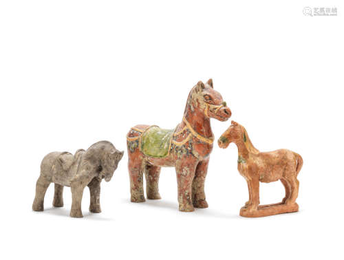 A grey pottery standing horse and two glazed pottery horses Yuan Dynasty and possibly Song Dynasty