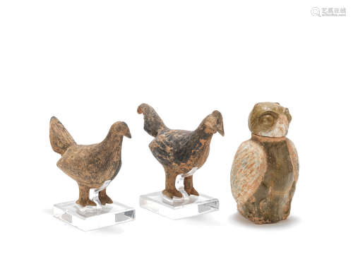 Two grey pottery models of a cockerel and hen; and a partly glazed owl-form jar and cover Northern Wei and Han Dynasty