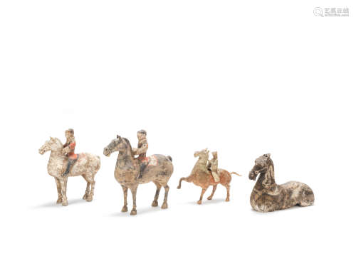 A group of pottery equestrians and a painted grey pottery recumbent horse Han Dynasty