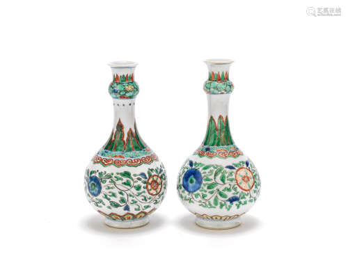 An associated pair of famille verte bottle vases Kangxi
