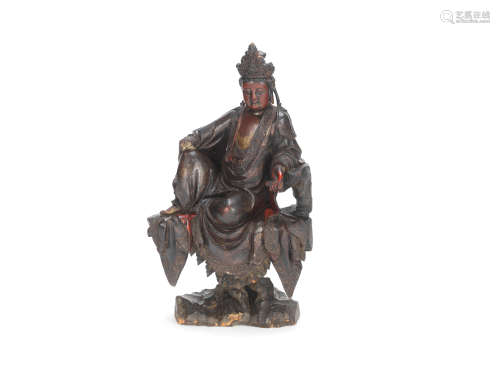A lacquered and gilt wood figure of Guanyin 17th/18th century