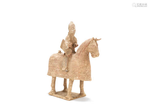 A painted pottery model of an armoured equestrian Western Jin Dynasty