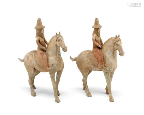 An unusual pair of painted pottery equestrians Tang Dynasty