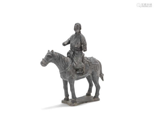 A dark grey pottery model of an equestrian Yuan Dynasty