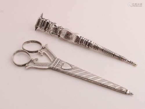 Silver scissors and knitting sheath