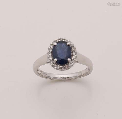 White gold ring with sapphire and diamond