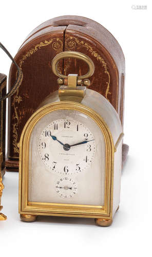 A good early 20th century French small hump back carriage alarm timepiece in original silk-lined gilt-tooled leather travelling case L. Le Roy et Cie, 7, Bd. de la Madeleine, Paris, number 20039, further numbered 2411.