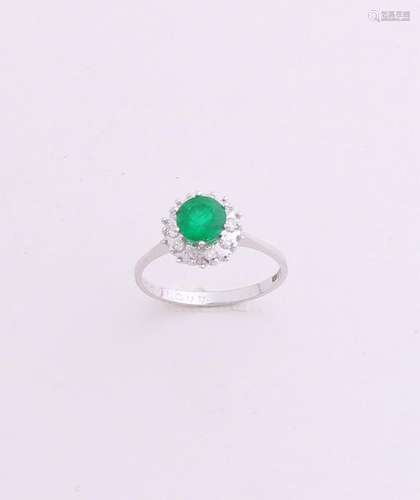 White gold ring with green stone