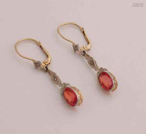 Earrings with orange stone