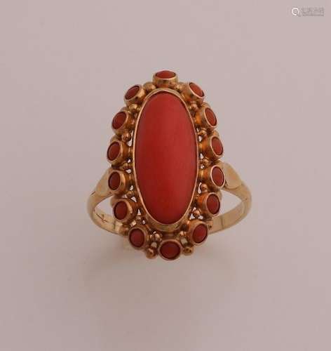 Gold ring with red coral