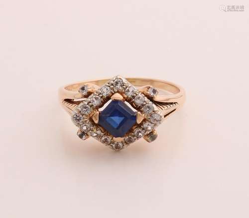 Gold ring with sapphire and cubic zirconia