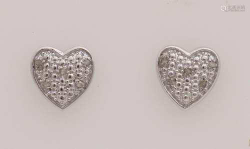 Silver ear studs with diamond.