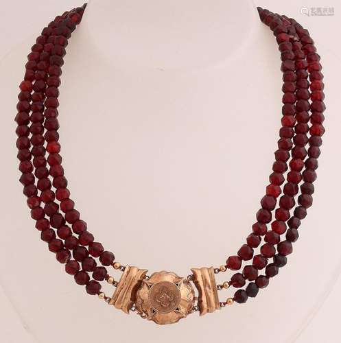 Garnet necklace with gold tone lock