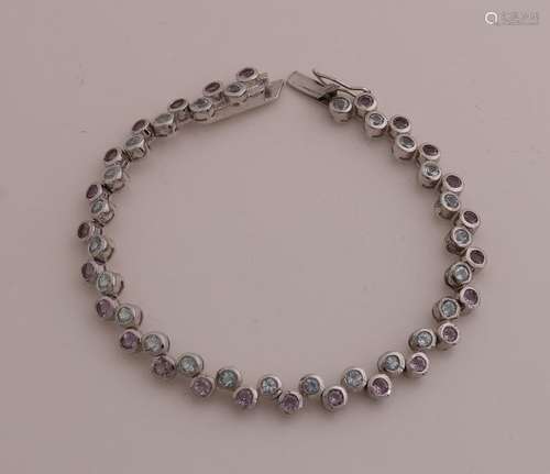 Silver bracelet with blue topaz and amethyst