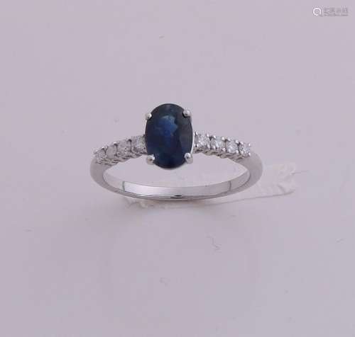 White gold ring with diamond and sapphire