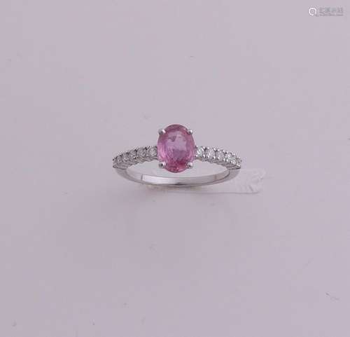 White gold ring with pink sapphire and diamond