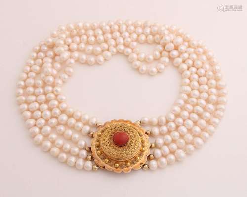 Pearl necklace with gold tone lock