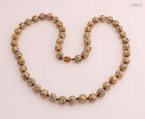 Gold colored beaded necklace