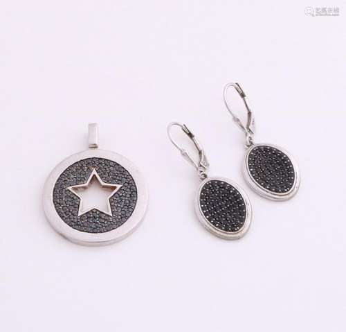 Silver pendant and earrings with black stones