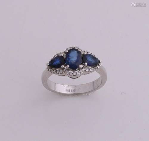 White gold ring with diamond and sapphire