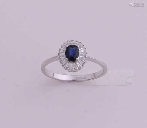 White gold ring with sapphire and diamond