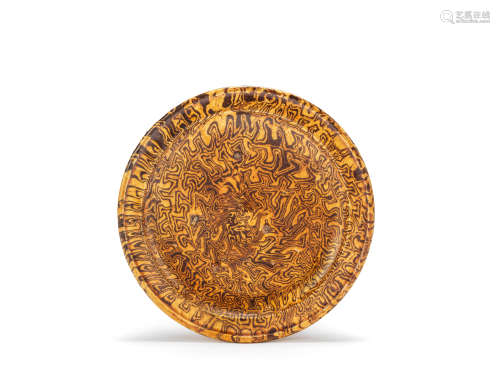 An amber-glazed marbled-clay tripod dish Tang Dynasty