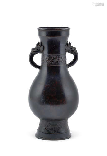 A large bronze dragon-handled pear-shaped vase, hu  Yuan/Ming Dynasty