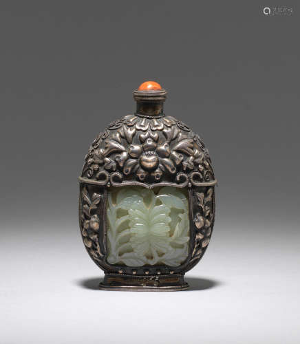 A green jade-inlaid white metal repoussé bottle  The jade plaques, 18th century; the bottle late 19th/early 20th century