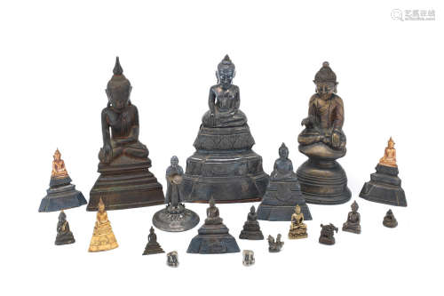 A large group of variously bronze, white metal and yellow metal Buddhist figures and weights  Thailand, Burma and Tibet, 19th century and later