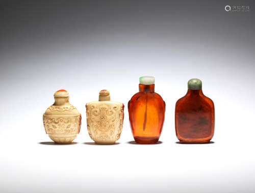 Two hornbill and two amber snuff bottles  19th century