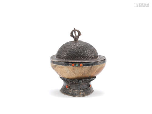 A white metal-mounted kapala, cover and stand  Tibet, 19th century